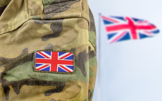 Military,Man,Posing,In,Front,Of,Uk,Flag Military,Man,Posing,In,Front,Of,Uk,Flag