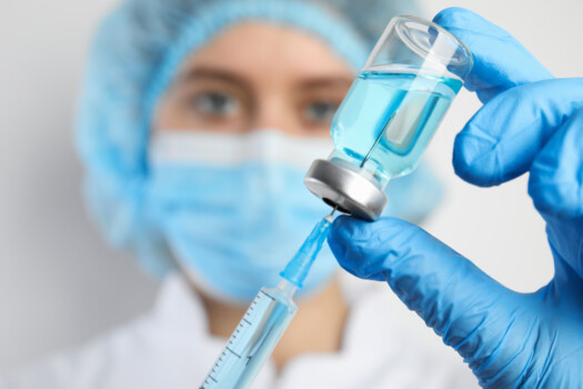 Doctor,Filling,Syringe,With,Medication,,Closeup.,Vaccination,And,Immunization Doctor,Filling,Syringe,With,Medication,,Closeup.,Vaccination,And,Immunization