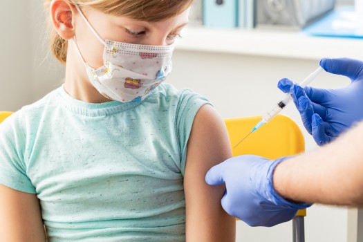 Little,Girl,In,Face,Mask,In,Doctor's,Office,Is,Vaccinated. Little,Girl,In,Face,Mask,In,Doctor's,Office,Is,Vaccinated.